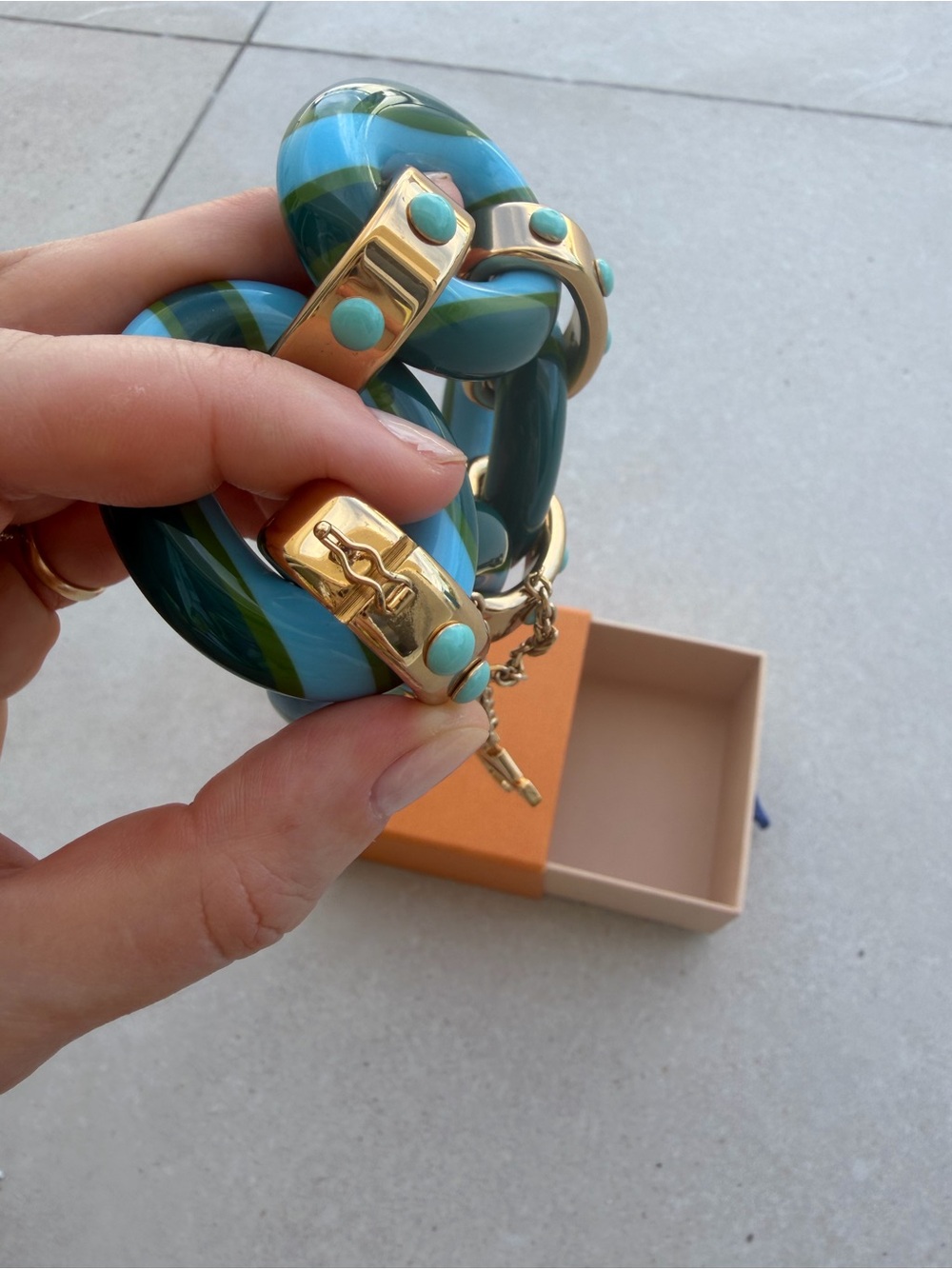 Louis Vuitton Blue and Turquoise Striped Resin Bracelet with Gold LV Charm - Picture 10 of 13